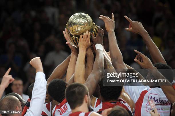 Nancy's players hold their trophy celebrating they won the French Pro A basketball final match Nancy vs. Roanne, on June 15, 2008 in Paris. Nancy won...