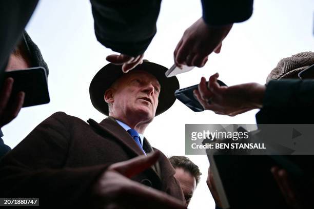 Trainer Willie Mullins speaks to members of the media after the victory of State Man in the Champion Hurdle on the first day of the Cheltenham...
