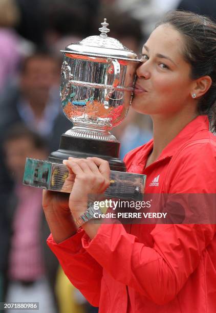 Serbian player Ana Ivanovic kisses her trophy after winning against Russian player Dinara Safina during their French tennis Open final match at...