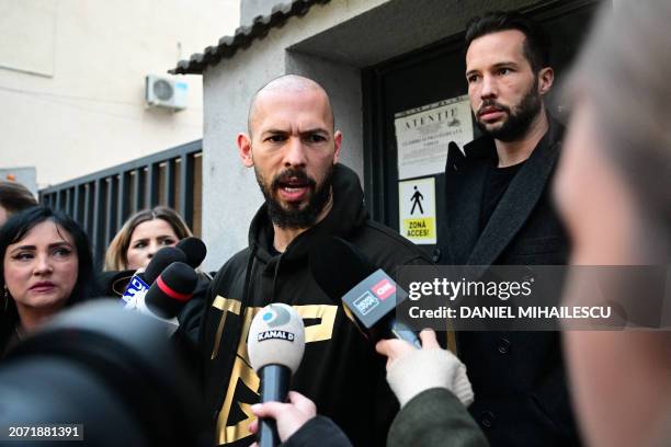 British-US former professional kickboxer and controversial influencer Andrew Tate and his brother Tristan Tate speak to journalists after having been...