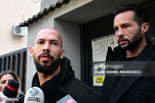 British-US former professional kickboxer and controversial influencer Andrew Tate and his brother Tristan Tate speak to journalists after having been...