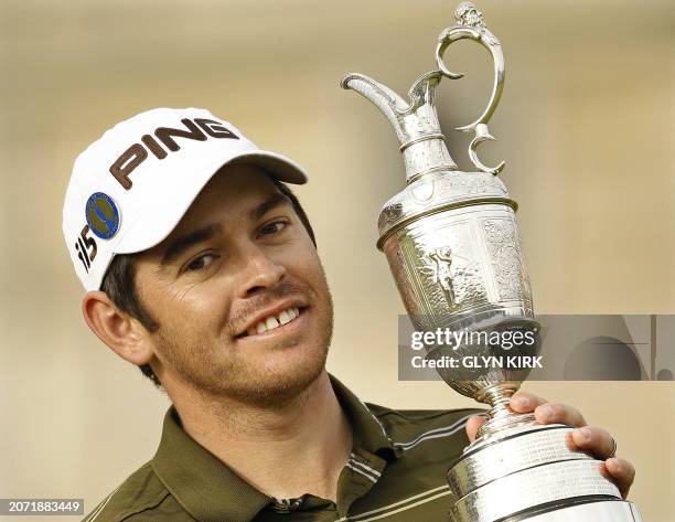 South African golfer Louis Oosthuizen kisses the Claret Jug, the trophy for the Champion golfer of the year after winning the 139th British Open Golf...