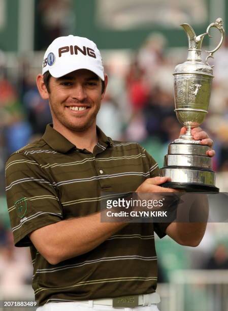 South African golfer Louis Oosthuizen with the Claret Jug, the trophy for the Champion golfer of the year after winning the 139th British Open Golf...