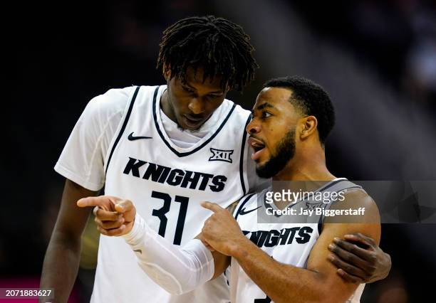 Shemarri Allen of the UCF Knights talks with Thierno Sylla during the first half against the Oklahoma State Cowboys of the Big 12 Men's Basketball...