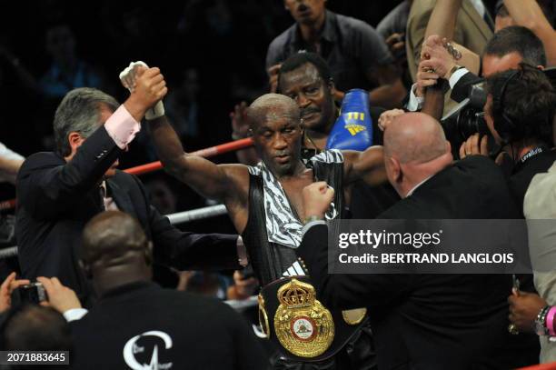 French Souleymane Mbaye celebrates after defeating Canadian Antonin Decarie following their WBA World Championship Welterweight match at the Marcel...