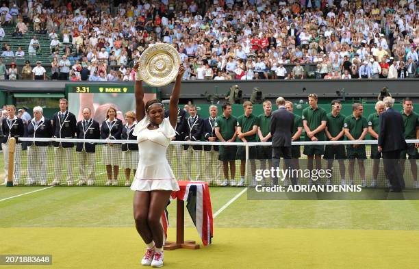 Serena Williams of US holds the Wimbledon Trophy after defeating Vera Zvonareva of Russia in the Women's Final at the Wimbledon Tennis Championships...