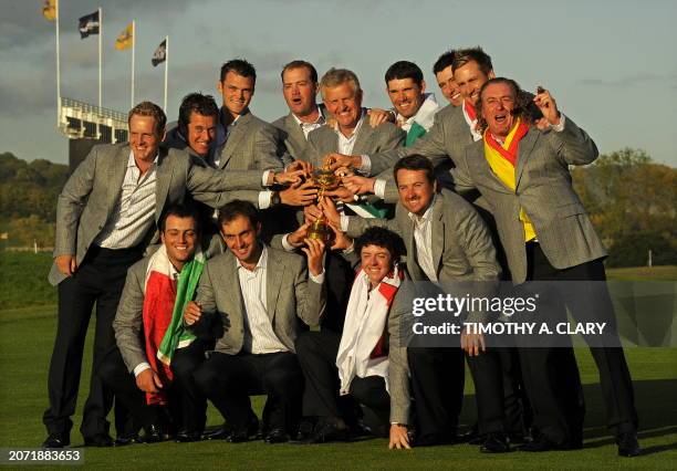 The Europe Ruder Cup team pose for pictures after beating the US by 14 1/2 points to 13 1/2 points on the final day of the 2010 Ryder Cup golf...