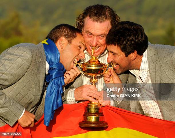 Europe Ryder Cup player Miguel Angel Jimenez poses for pictures wth vice-captains Sergio Garcia and Jose Maria Olazabal after Europe beat the US by...