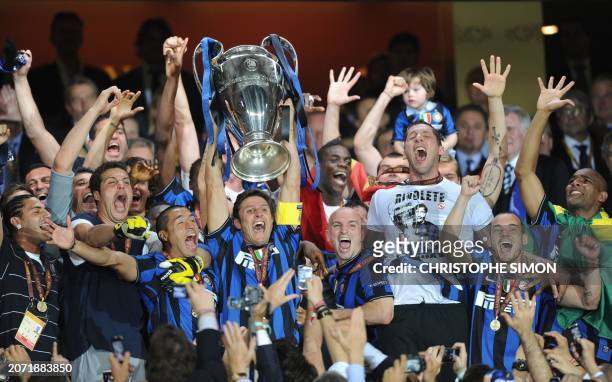 Inter Milan players celebrate with the trophy after winning the UEFA Champions League final football match Inter Milan against Bayern Munich at the...