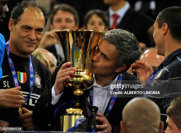 Inter Milan's Portuguese coach Jose Mourinho kisses the Cup after his team defeated AS Roma in the Coppa Italia final on May 5, 2010 at Olimpico...