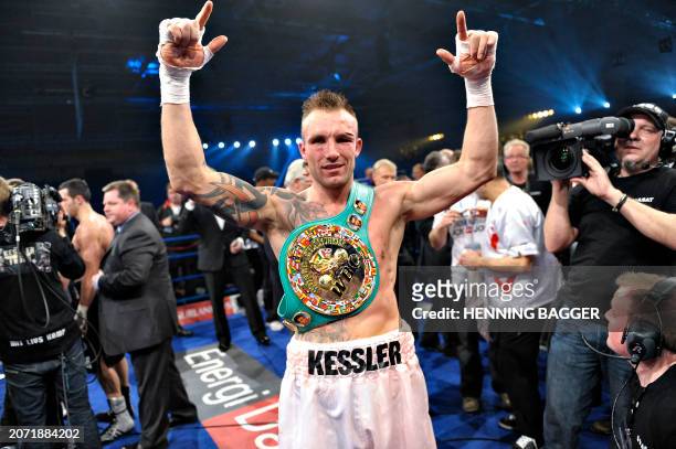 Mikkel Kessler of Denmark jubilates after winning an unanimous 3-0 point victory over Carl Froch of the United Kingdom at the end of their...