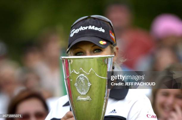 Golf player Natalie Gulbis poses with her trophy after winning the 2007 Evian Masters Tournament, 29 July 2007 in Evian, in French Alps. AFP PHOTO...