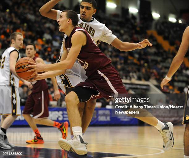 Scotia's Joe Cremo, #24, drives to the basket during the Class A boys' basketball state final against Greece Athena on Sunday, March 22, 2015 in...