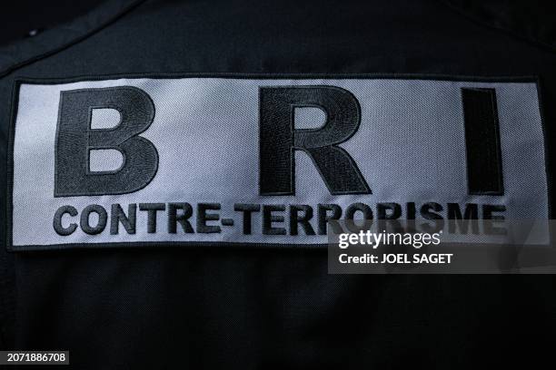 This photograph taken on March 11 shows the coat of arms with the logo of the French National Police BRI Counter-Terrorist Unit, at the headquarters...