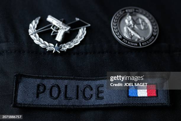 This photograph taken on March 11 shows the coat of arms with the logo of Police, at the headquarters of its unit, in Paris.