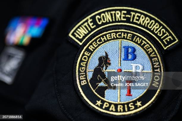This photograph taken on March 11 shows the coat of arms with the logo of the French National Police BRI Counter-Terrorist Unit, at the headquarters...