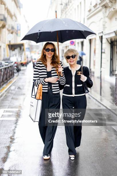 Alexandra Lapp is seen wearing a Mango striped tweed jacket in black and white, a Colorful Standard tank top in black, Rossi pants in black, a Celine...
