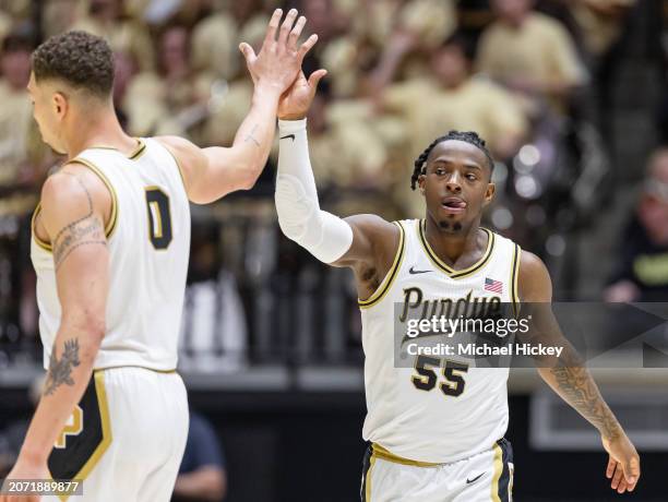 Mason Gillis and Lance Jones of the Purdue Boilermakers high five during the game against the Wisconsin Badgers at Mackey Arena on March 10, 2024 in...