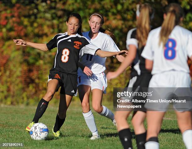 Cambridge's Miranda Seacord, left, battles with Maple Hill's Tori Whimple during a soccer game on Monday, Oct. 12, 2015 in Castleton, N.Y.