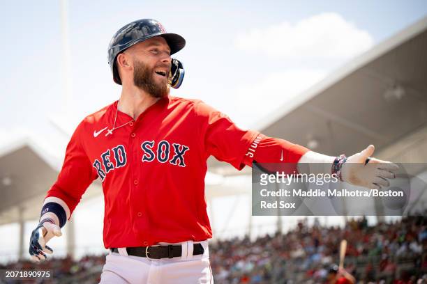 Trevor Story of the Boston Red Sox reacts after hitting a two-run home run during a Spring Training game against the St. Louis Cardinals at JetBlue...