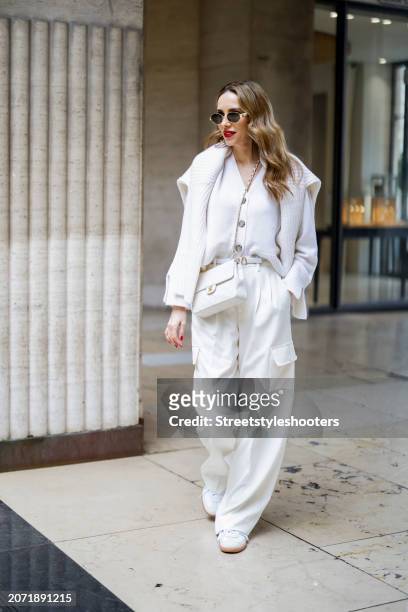Alexandra Lapp is seen wearing a Allude cashmere jacket and pullover in white from Unger-Fashion, Rossi Cargo pants in creme, Celine Triomphe...