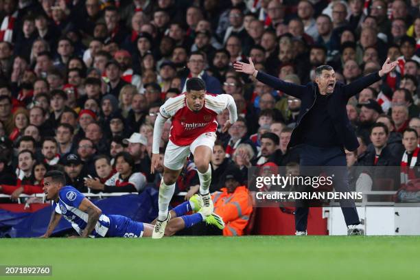 Porto's Portuguese coach Sergio Conceicao reacts following a tackle by Arsenal's French defender William Saliba on his player Porto's Brazilian...