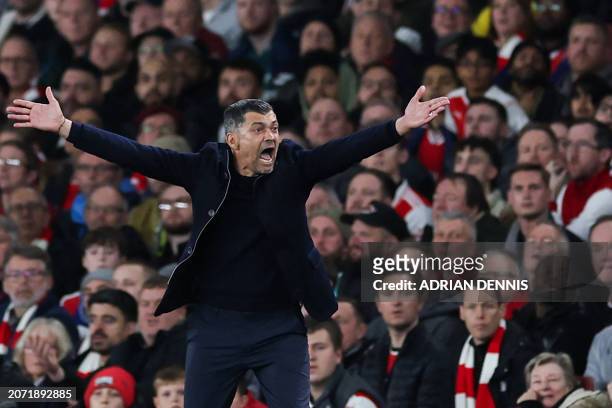 Porto's Portuguese coach Sergio Conceicao reacts during the UEFA Champions League last 16 second leg football match between Arsenal and Porto FC at...