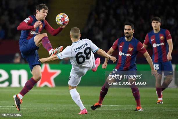 Barcelona's Danish defender Andreas Christensen and Napoli's Slovak midfielder Stanislav Lobotka vie for the ball during the UEFA Champions League...