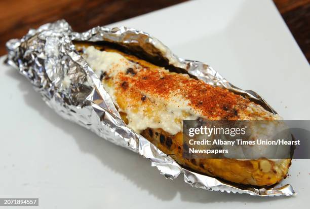 Mexican street corn at The City Beer Hall Monday, June 23, 2014 in Albany, N.Y. Grilled corn cob on a skewer, served with queso fresco mayo, cayenne...