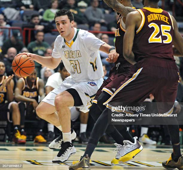 Siena's Brett Bisping tries to drive baseline to the hoop during a basketball game against Iona at the Times Union Center on Monday, Feb. 22, 2016 in...