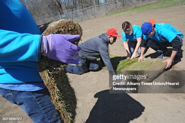 Volunteers lay sod at the Upstate Premier Baseball field on Thursday, April 14, 2016 in Schenectady, N.Y. The Tri-City ValleyCats, with the support...