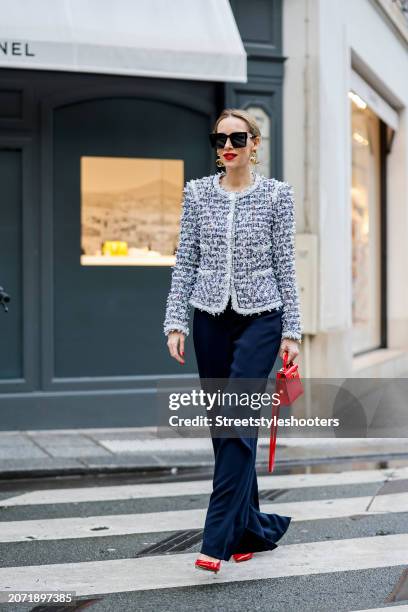 Alexandra Lapp is seen wearing a Maison Common Signature tweed jacket in navy, Maison Common Cotton Blend pants in black, CHhanel vintage ear clips...