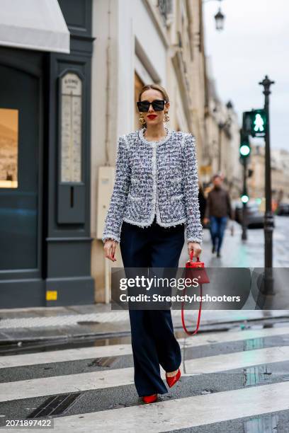 Alexandra Lapp is seen wearing a Maison Common Signature tweed jacket in navy, Maison Common Cotton Blend pants in black, CHhanel vintage ear clips...