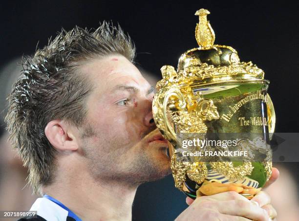 New Zealand All Blacks captain Richie McCaw kisses the cup after the 2011 Rugby World Cup final match New Zealand vs France at Eden Park Stadium in...