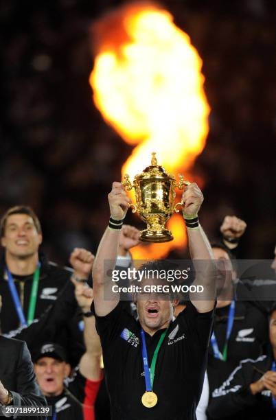New Zealand All Blacks captain Richie McCaw holds the Webb Ellis cup after the 2011 Rugby World Cup final match New Zealand vs France at Eden Park...