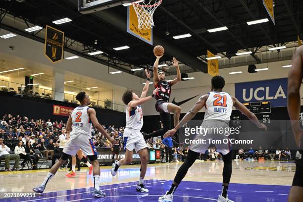 Max Lewis of the South Bay Lakers shoots the ball over Isaiah Roby of the Westchester Knicks during the game on March 11, 2024 at UCLA Health...