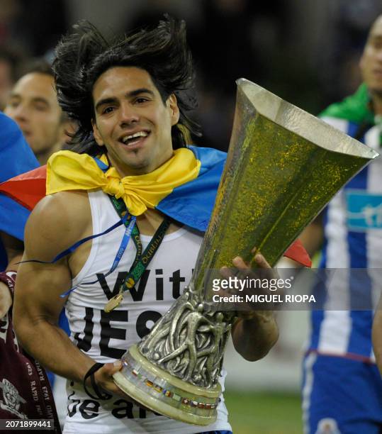 Porto's Colombian forward Falcao carries the UEFA Europa League Trophy after beating SC Braga 1-0 during the UEFA Europa League Final football game...
