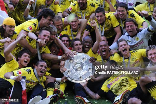 Dortmund's players celebrate with the trophy after the German first division Bundesliga football match Borussia Dortmund vs Eintracht Frankfurt in...