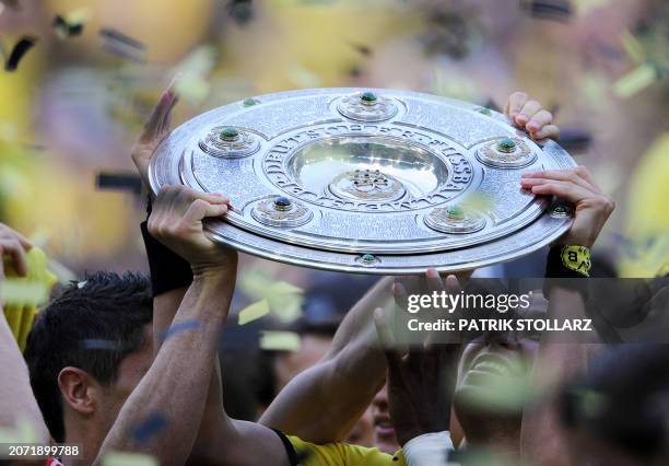 Dortmund`s Kevin Grosskreutz celebrates with the trophy after the German first division Bundesliga football match Borussia Dortmund vs Eintracht...