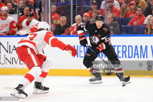 Jeff Skinner of the Buffalo Sabres controls the puck against Moritz Seider of the Detroit Red Wings during an NHL game on March 12, 2024 at KeyBank...
