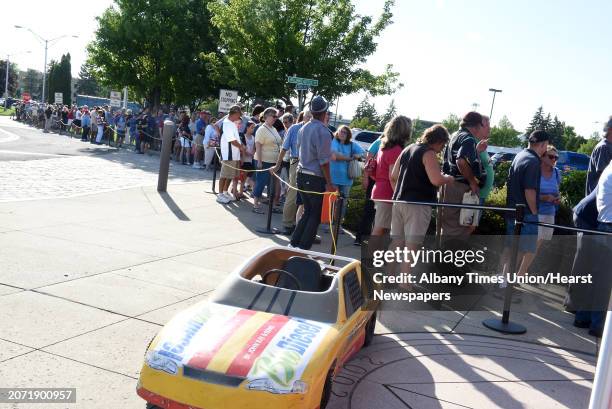 People wait in a long line to receive a bobblehead at the Tri-City ValleyCats baseball game against the Brooklyn Cyclones at Joe Bruno Stadium on...