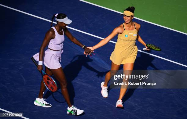 Asia Muhammad of the United States and Ena Shibahara of Japan in action against Jessica Pegula of the United States and Coco Gauff of the United...