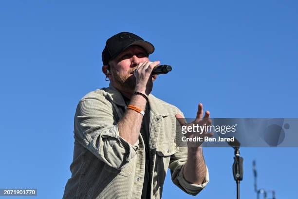 Singer-songwriter Cole Swindell performs during the Military Appreciation Day Ceremony prior to THE PLAYERS Championship at Stadium Course at TPC...