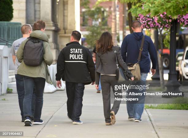 Tanya Hajjar, assistant United States attorney for the Eastern District of New York, second from right, leaves the federal courthouse after an...