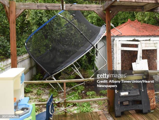 Trampoline flew threw the air and landed on a garage in back of a home on Marshall St. After a storm came through on Tuesday, Aug. 7, 2018 in Albany,...