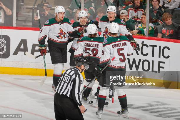 Nick Bjugstad celebrates his goal with his teammates Michael Kesselring, Michael Carcone, Matias Maccelli and Juuso Valimaki of the Arizona Coyotes...