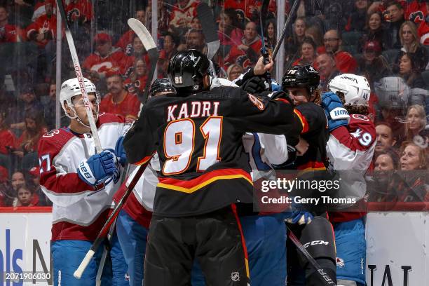 Nazem Kadri of the Calgary Flames battles after the whistle against the Colorado Avalanche at Scotiabank Saddledome on March 12, 2024 in Calgary,...