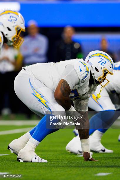 Jerrod Clark of the Los Angeles Chargers in an offensive stance during a game against the Los Angeles Rams at SoFi Stadium on August 12, 2023 in...