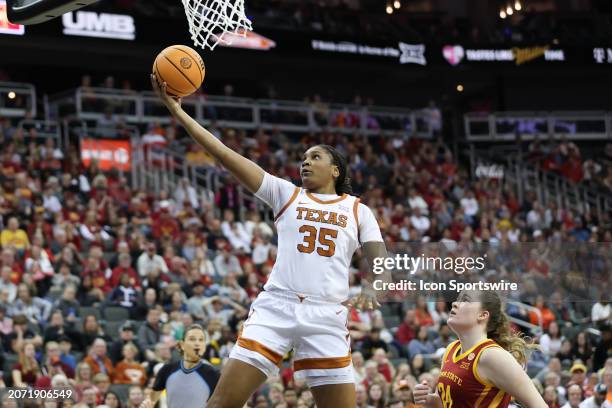 Texas Longhorns forward Madison Booker goes in for a layup in the second quarter of the women's Big 12 tournament final between the Iowa State...