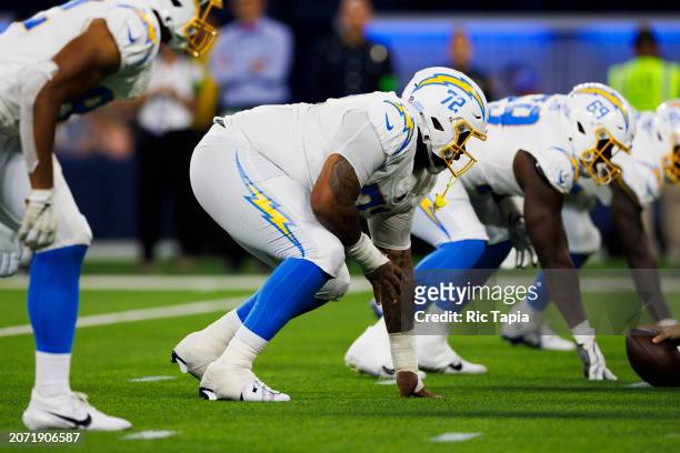Jerrod Clark of the Los Angeles Chargers in an offensive stance during a game against the Los Angeles Rams at SoFi Stadium on August 12, 2023 in...